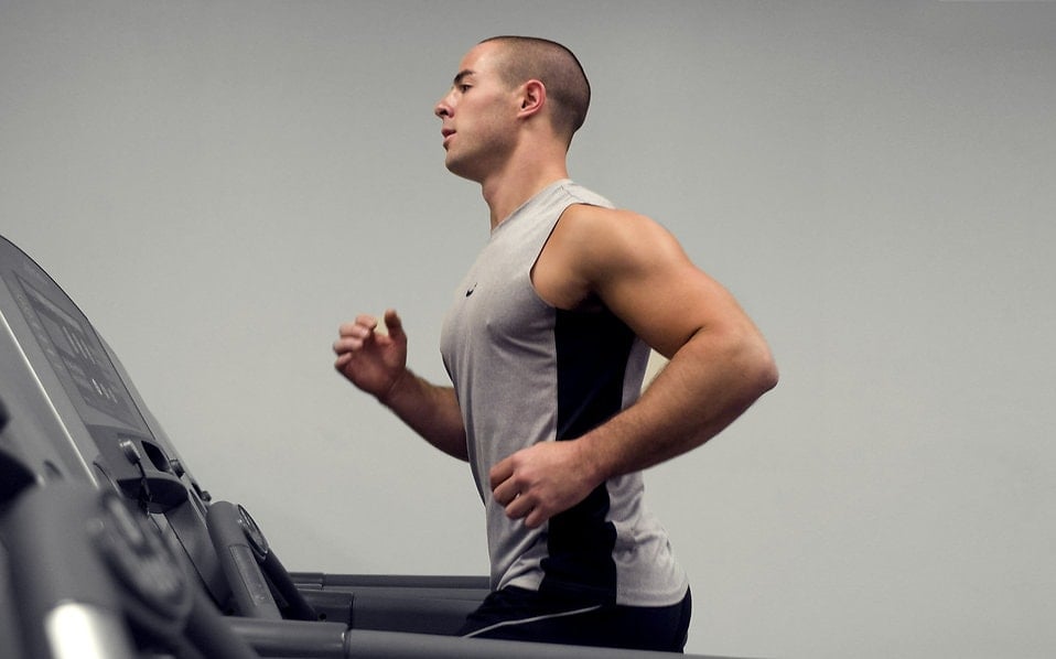 15397 A Healthy Young Man Running On A Treadmill In A Gym Pv Min