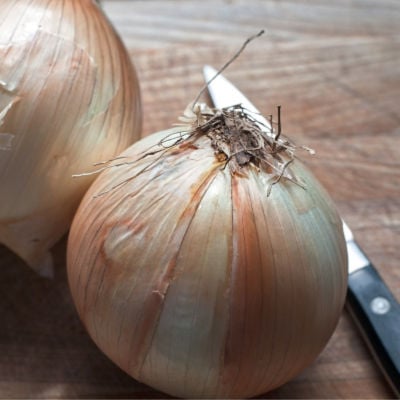 Vidalia onions on a chopping board