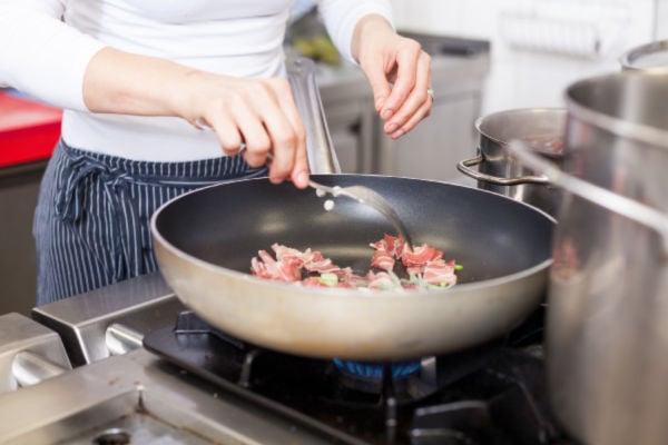 Frying meat in a pan