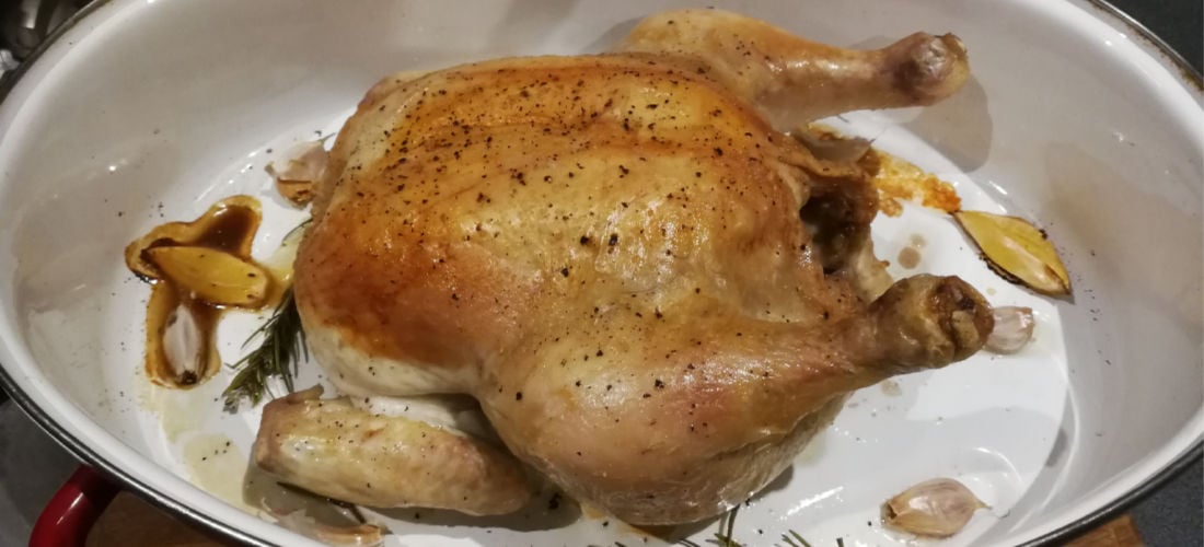 Chicken roasting in a pan