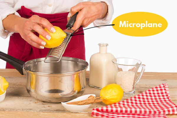 Zesting lemon using a microplane