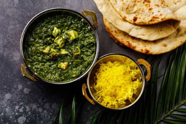 Bowls of basmati rice and palak