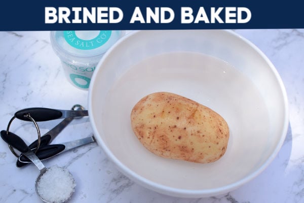 A potato in a bowl of brine