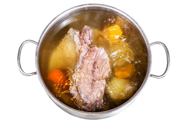 Beef broth cooking in a pot