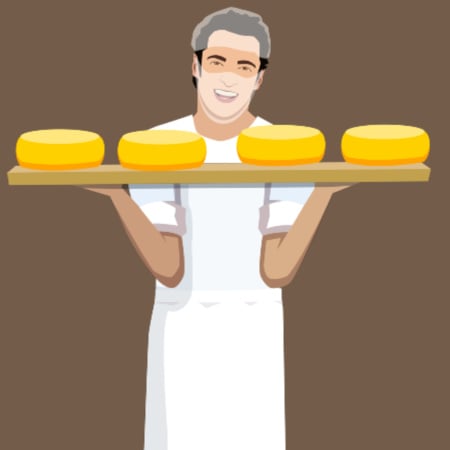 Man holding mature cheese wheels