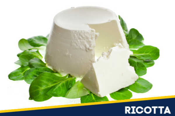 Ricotta surrounded by herbs.