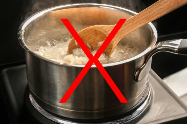 Stirring rice in a saucepan