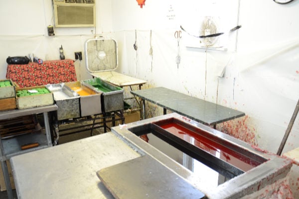 A cheese making room with melted red wax