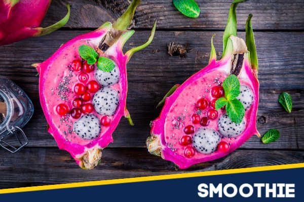 A vibrant smoothie inside dragonfruit skins.