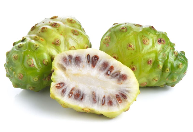 Sliced noni on a white background