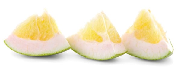Slices of pomelo on a white background