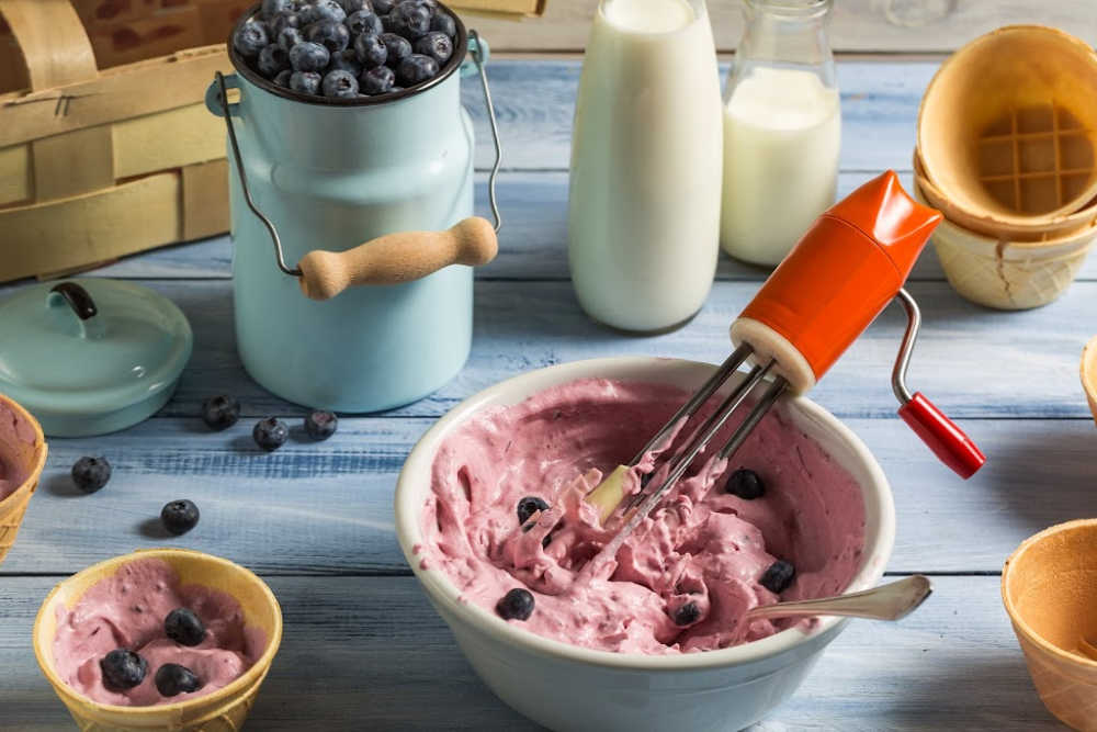 Homemade blueberry ice cream in a bowl after whipping