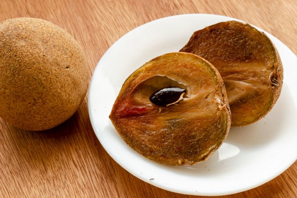 Cut sapote on a plate