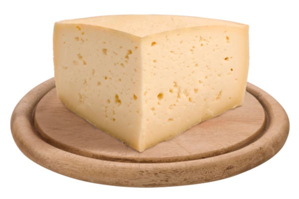 A block of asiago on a board