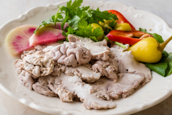 Beyin sogus with salad on a plate