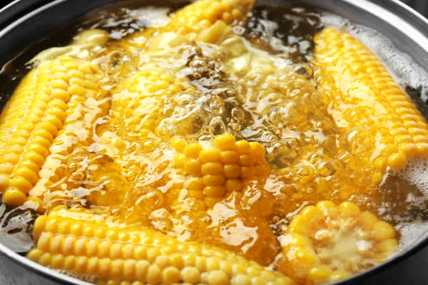 Corn boiling in a pot