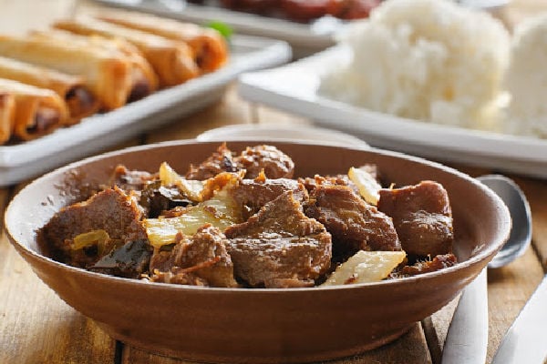 Adobo-seasoned meat in a dish