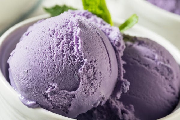 Scoops of ube ice cream in a plate