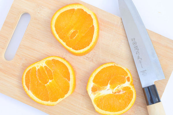 Orange slices on a chopping board