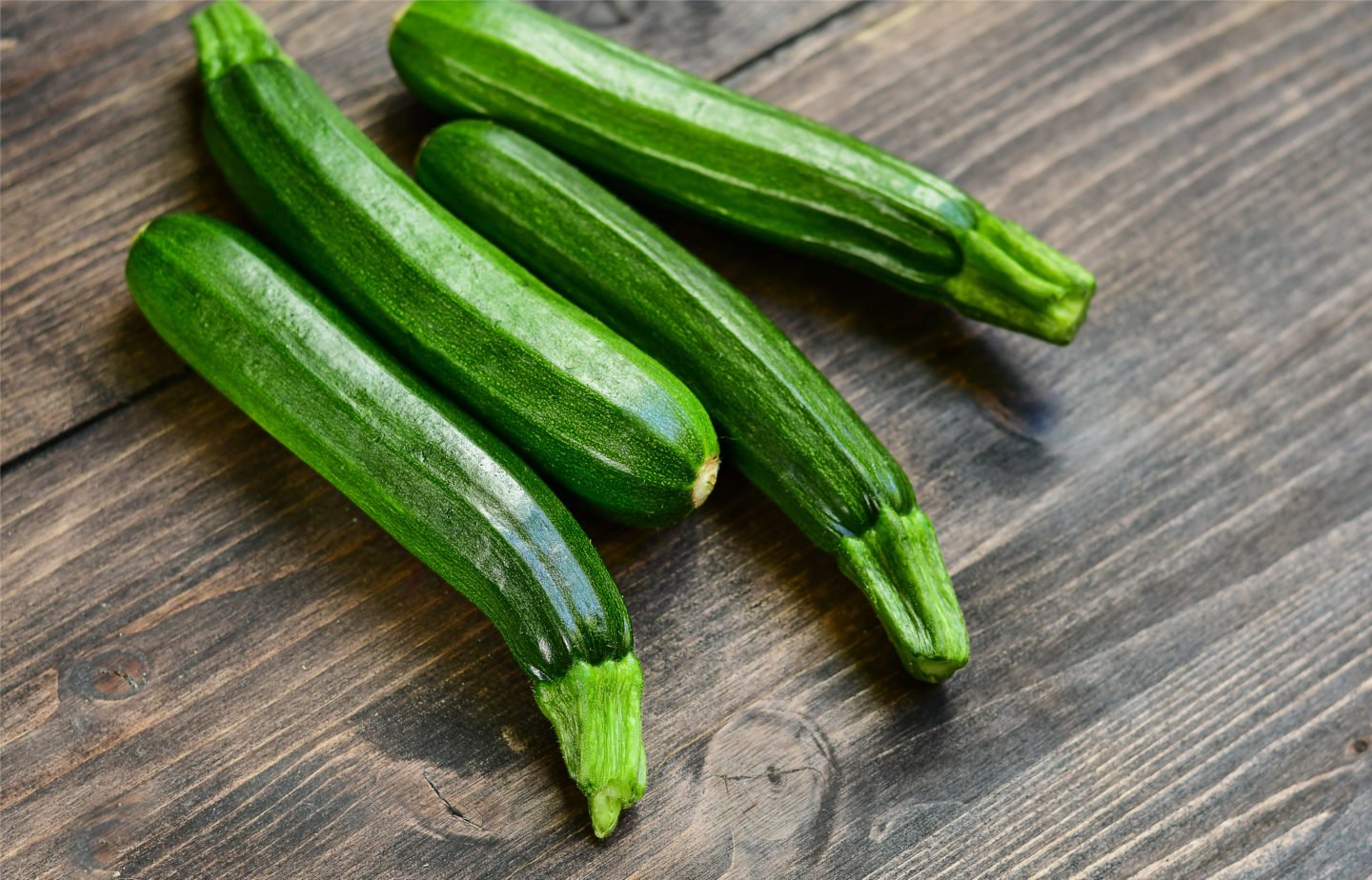 Fresh Organic Zucchini On Wooden Table