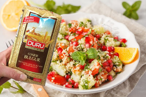 Coarse bulgur in a packet and a bulgur salad