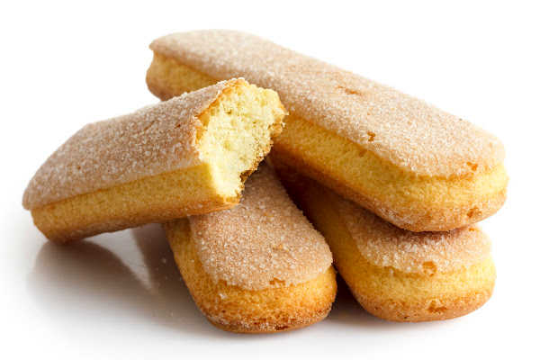 A pile of ladyfingers on a white background