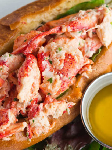 Lobster Roll next to a bowl of melted butter