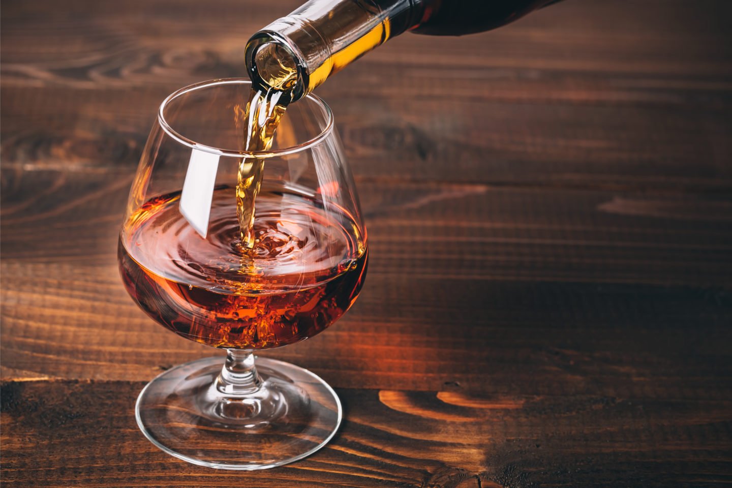 Pouring Brandy Into Glass