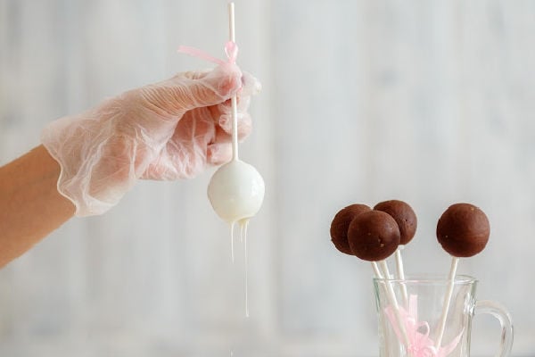 Dipping cake pops in chocolate