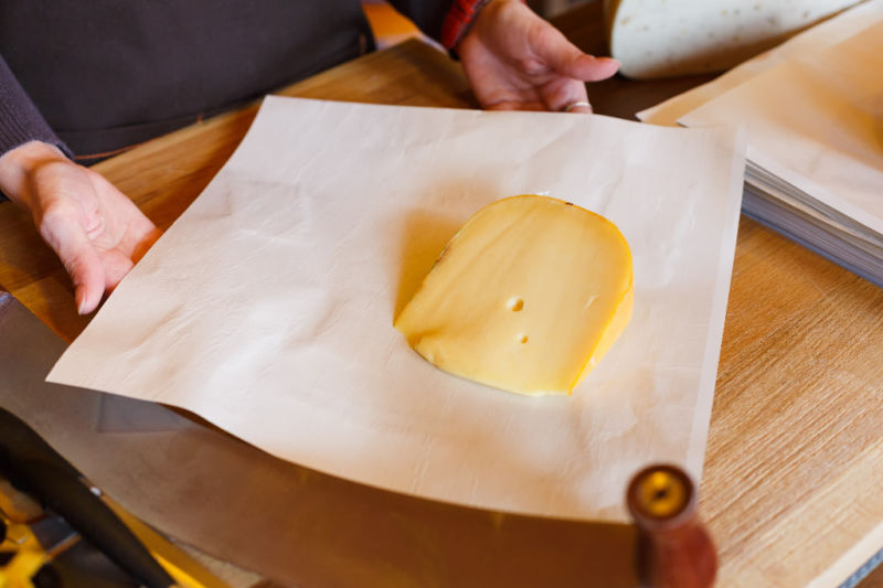 Wrapping cheese in paper