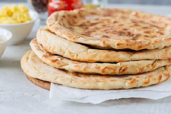 A stack of freshly made naan