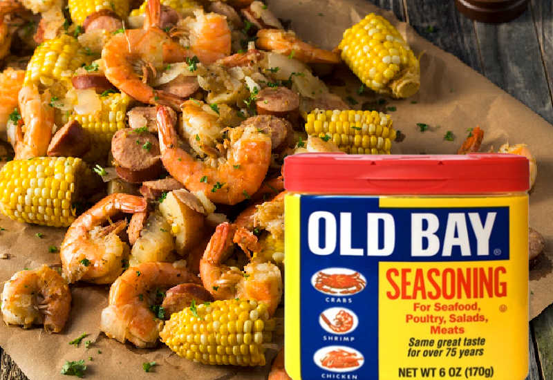 Old Bay Seasoning next to shrimp and corn