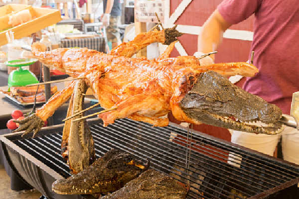 Crocodile cooking on a spit at a market