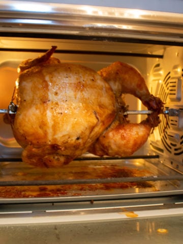 Cooking chicken in an air fryer oven with rotisserie