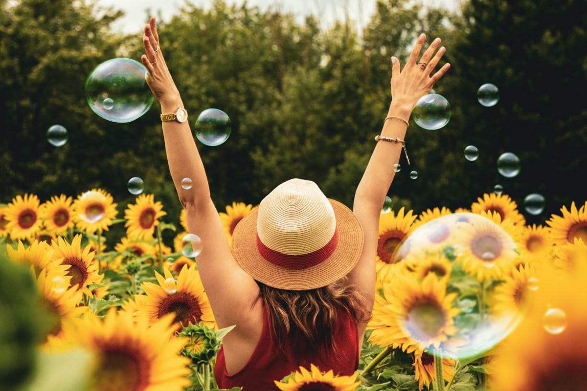 Happy woman sunflowers