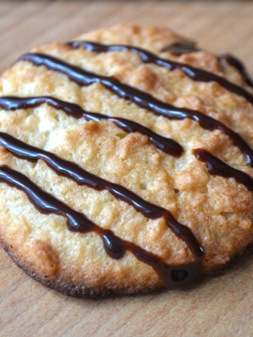 Keto coconut cookie topped with chocolate