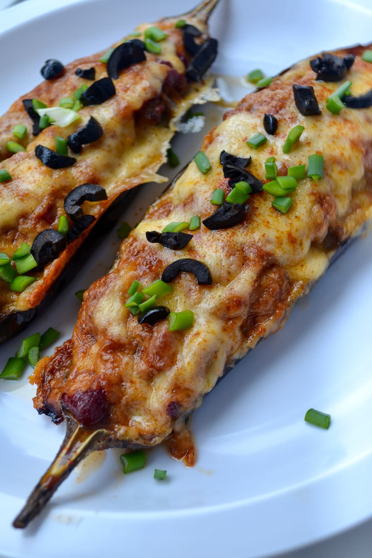 Stuffed eggplant boats on plate