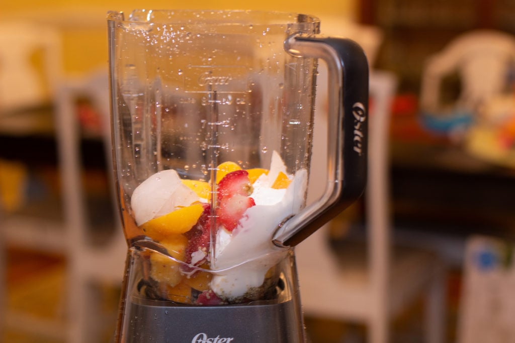 https://tastylicious.com/wp-content/uploads/2021/03/making-smoothie-on-oster-1024x683.jpg