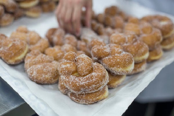 A tray of cinnamon twist donuts