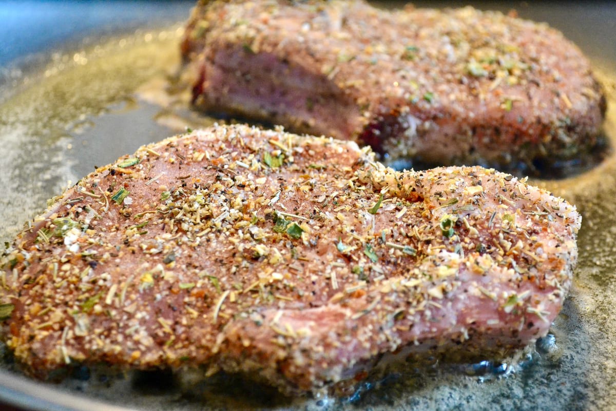 Keto pork chops frying