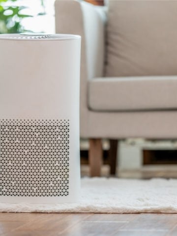 Air purifier in front of a couch
