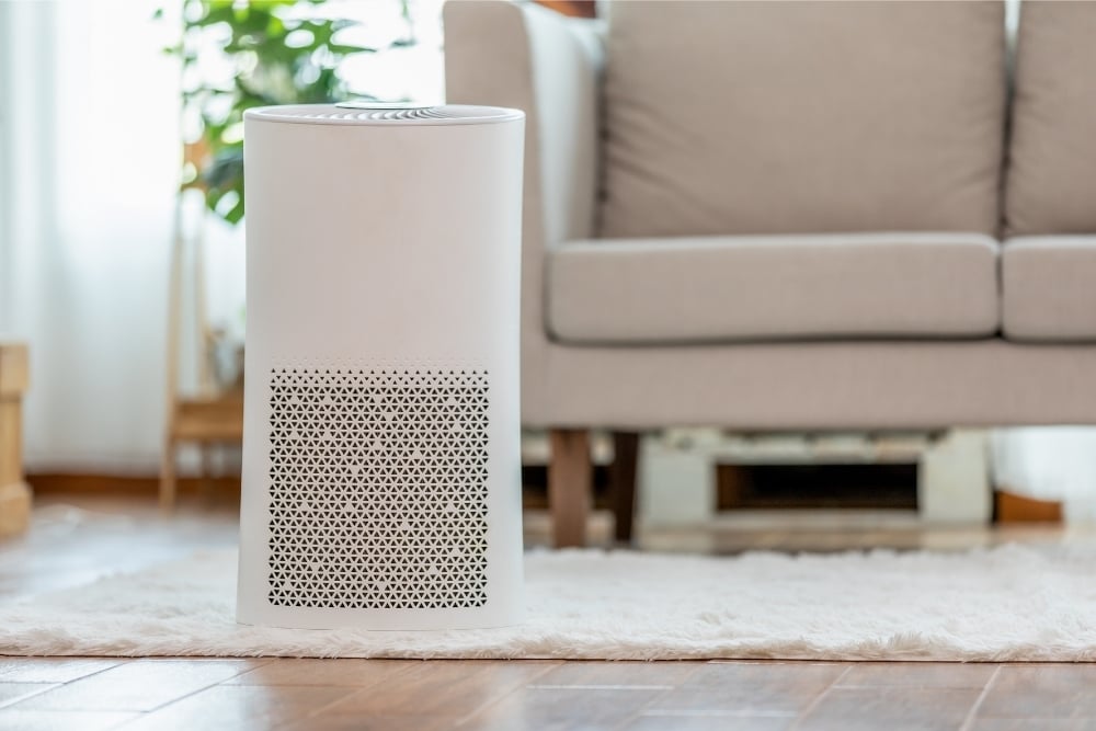 Air purifier in front of a couch