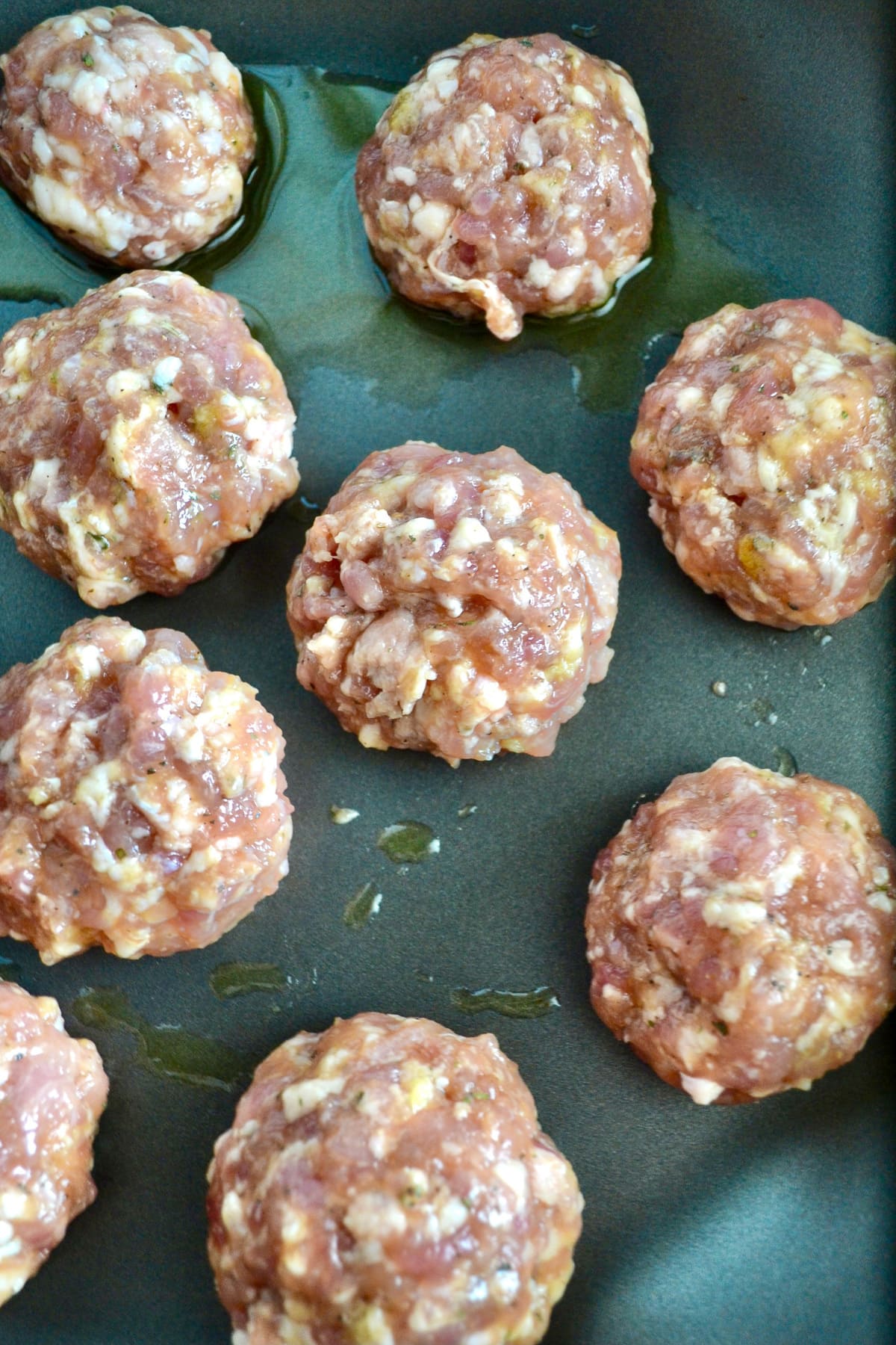 Keto Cheese-Stuffed Meatballs on skillet