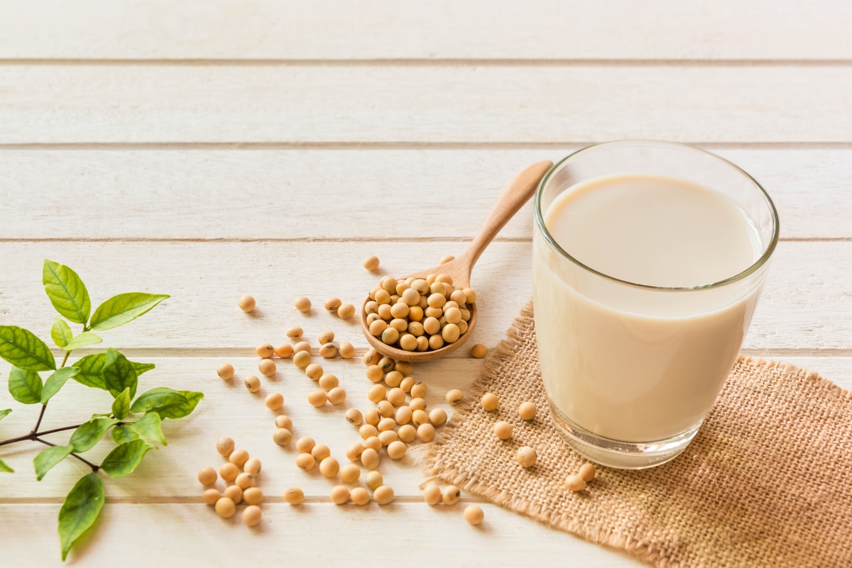 Soy milk on white table