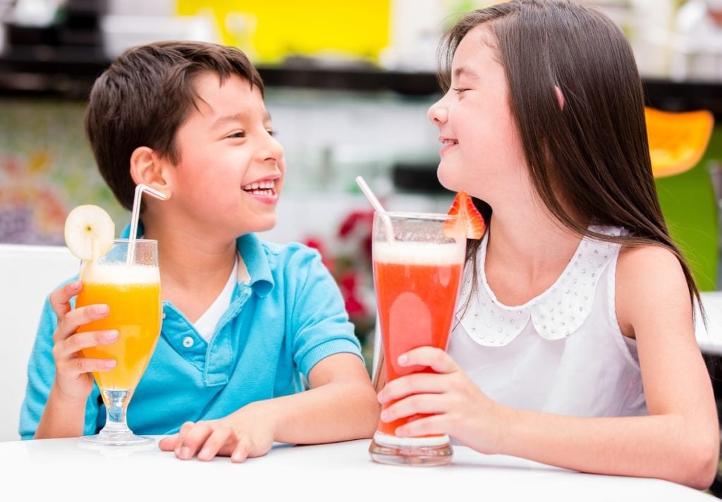 Healthy Kids Drinking Fresh Juice