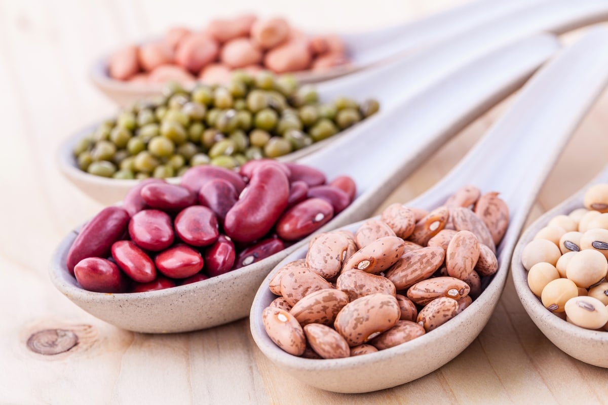 Assortment,Of,Beans,And,Lentils,In,Wooden,Spoon,On,Wooden