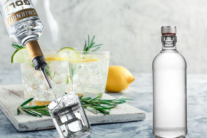 A vodka bottle next to cocktails and a shot of vodka