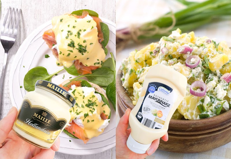 Holding bottles of hollandaise and mayonnaise sauces in front of eggs benedict and potato salad