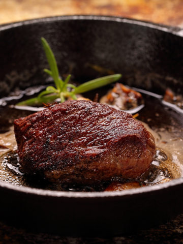 Beef steak on cast iron skillet