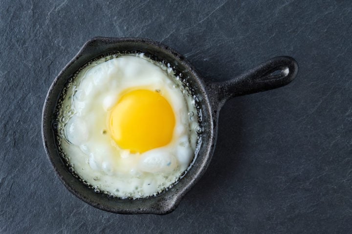 Top view of fried egg in small cast-iron skillet